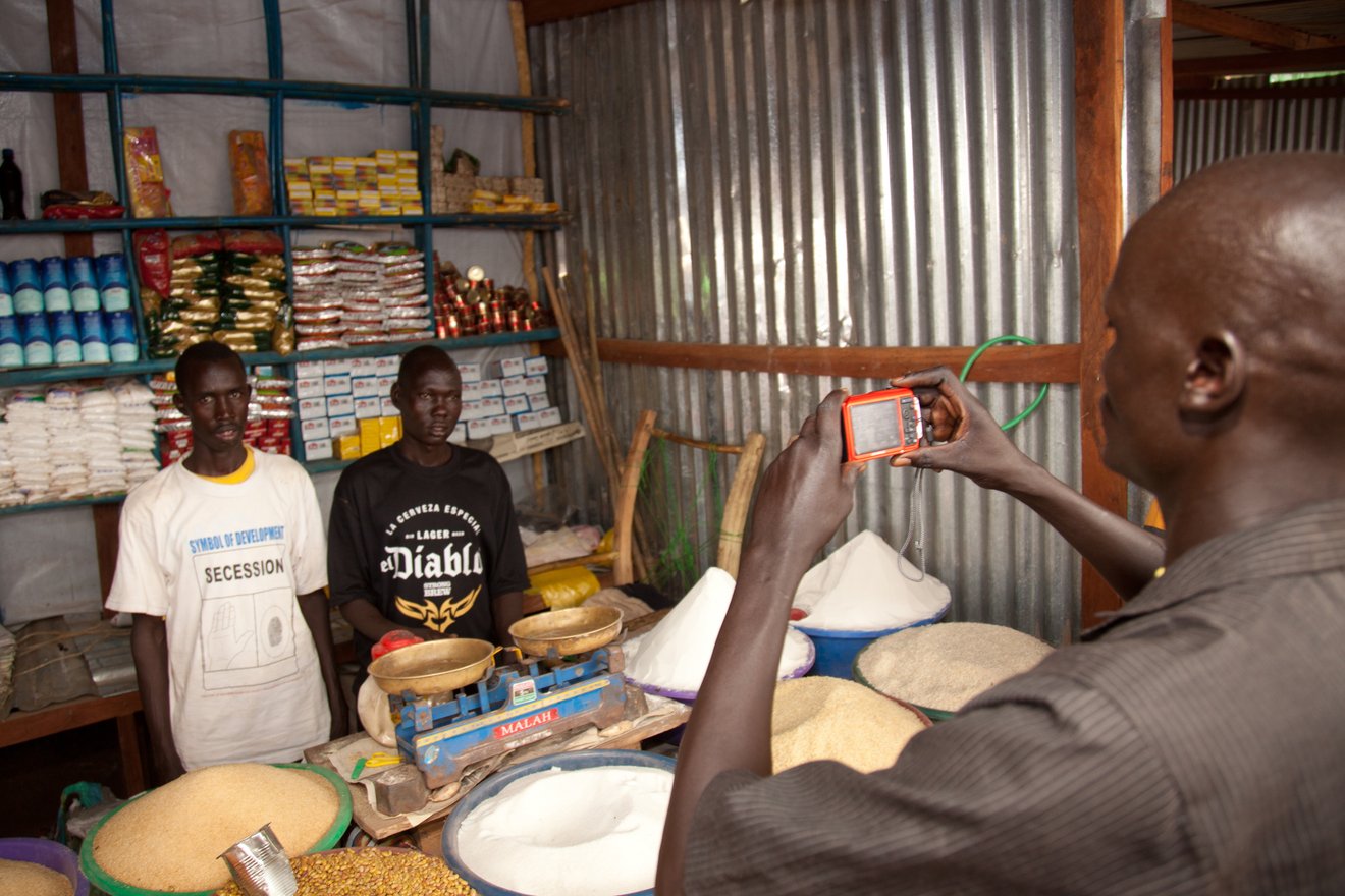 Kuajok, Warrap State, South Sudan. Saferworld Participatory Photography Project participant collecting images.