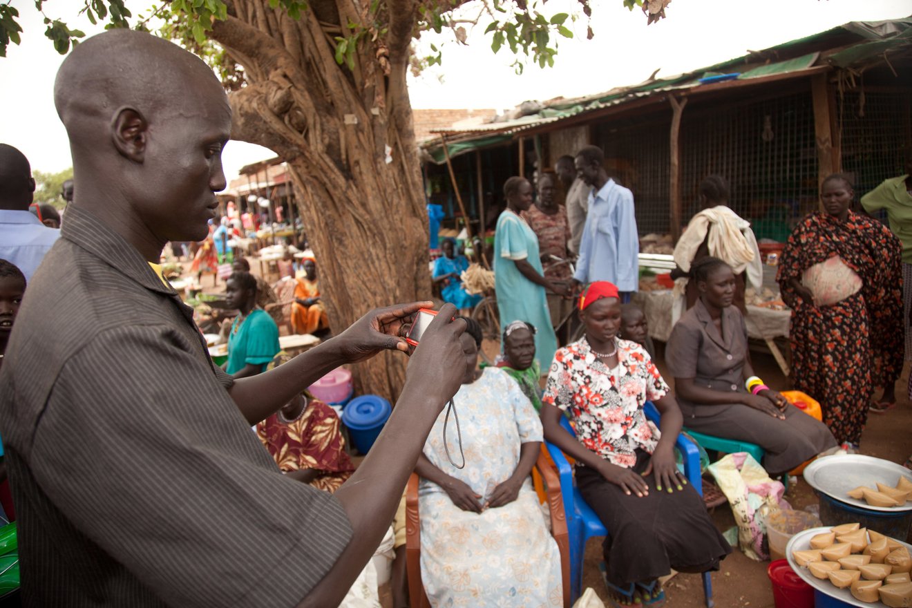 Kuajok, Warrap State, South Sudan. Saferworld Participatory Photography Project participant collecting images.